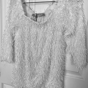 White fringe off the shoulder blouse/sweater